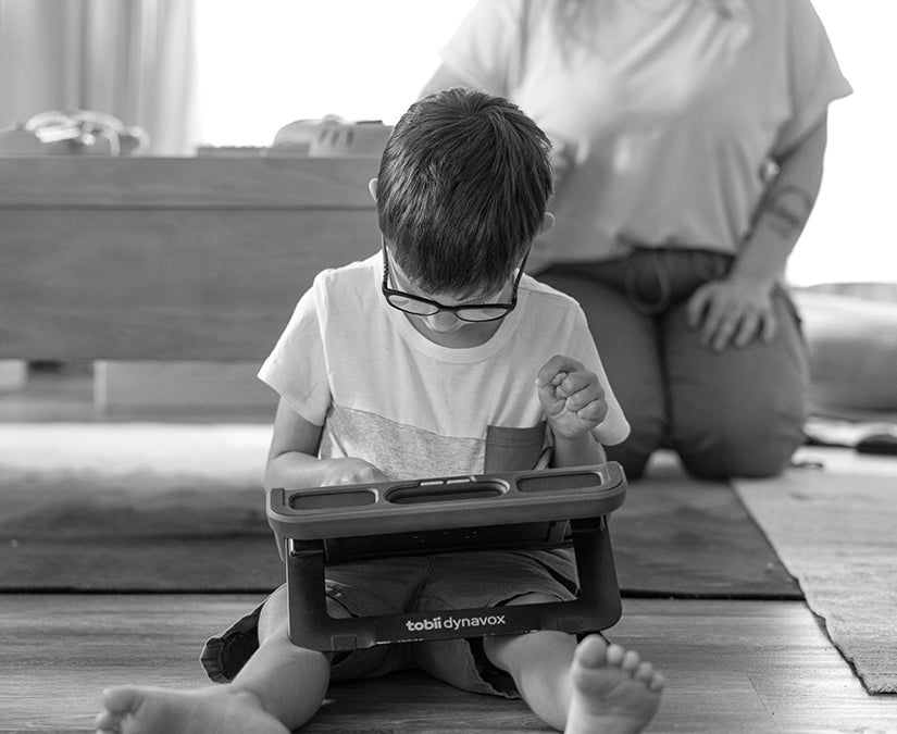 Autistic boy using a Tobii Dynavox TD Navio speech generation device for ACC