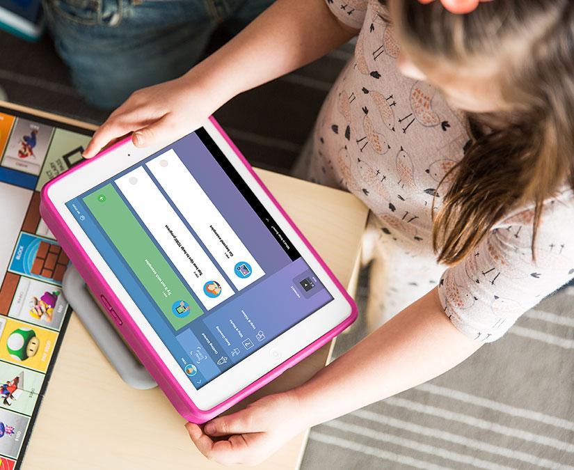 Girl using Tobii Dynavox Pathways for Snap Scene on a Speech Case